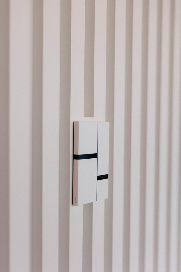 Lighting control installed on a white wall