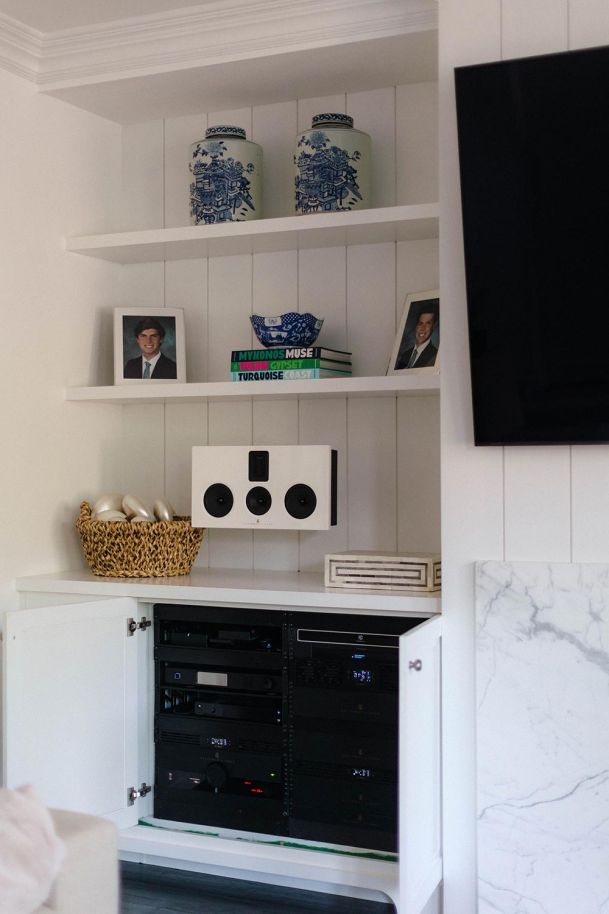 Steinway & Sons Speakers and hidden rack installation in a white and sand living room