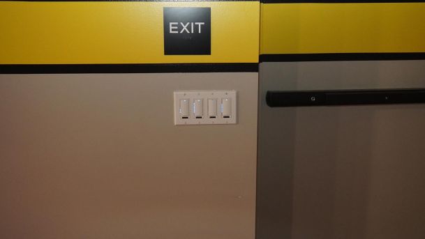 Light switches in a grey and yellow wall