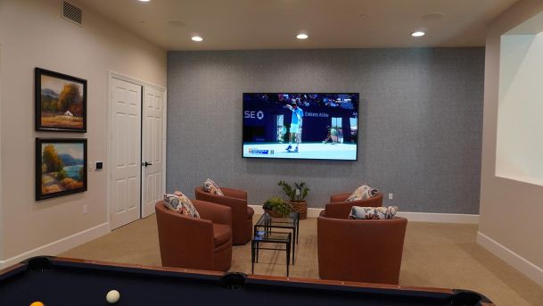 Game Room with TV hanging and in-ceiling speakers