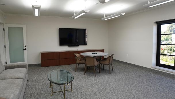 Car Barn Office With Black Tv And Sound Bar